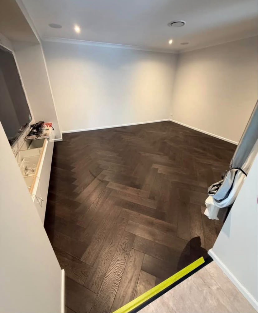 Dark herringbone timber floor freshly laid