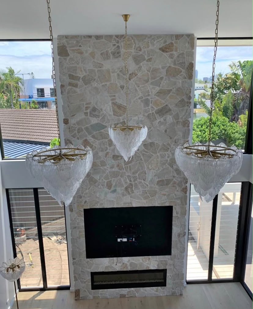Interior stone-clad fireplace feature wall